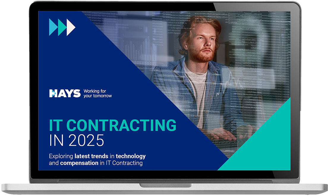 A laptop screen displays the “Hays Czech Republic Salary Guide 2025” with vibrant colors and smiling professionals.